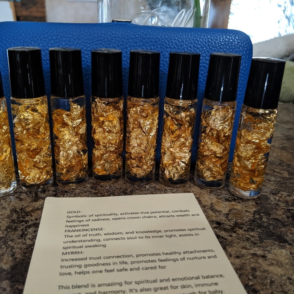 8 bottles with gold, mryh & frankincense